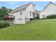The home has a large grassy backyard, a multi-level deck and convenient garage with a connecting breezeway at 2110 Mcgarity Rd, Mcdonough, GA 30252