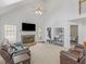 Spacious living room with vaulted ceilings, a cozy brick fireplace, and comfortable seating at 2110 Mcgarity Rd, Mcdonough, GA 30252