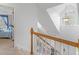 Bright staircase featuring wood railing, white balusters, and a window with decorative transom at 2110 Mcgarity Rd, Mcdonough, GA 30252