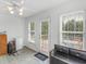 Cozy sunroom featuring natural light and access to outdoor deck at 2110 Mcgarity Rd, Mcdonough, GA 30252