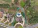 Aerial shot of a beautiful property line with a pool, trees and manicured landscaping showcasing the lot's boundaries at 5297 Heron Bay Blvd, Locust Grove, GA 30248
