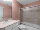 Bathroom featuring peach painted walls, framed glass enclosed shower, and a light colored vanity at 5297 Heron Bay Blvd, Locust Grove, GA 30248