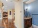 Elegant powder room with blue accent wall, vanity and bronze sconces near hardwood flooring and an open floorplan at 5297 Heron Bay Blvd, Locust Grove, GA 30248