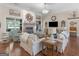 Cozy living room with hardwood floors, a stone fireplace, and soft furnishings for a comfortable and inviting atmosphere at 1103 Wilder Ct, Mcdonough, GA 30252
