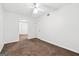 Neutral bedroom with plush carpet, fan, and an easy flow to connecting rooms at 954 Camp Creek Sw Dr, Lilburn, GA 30047