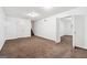 Inviting bedroom featuring carpet floors, neutral walls, and connecting rooms for flexible living at 954 Camp Creek Sw Dr, Lilburn, GA 30047