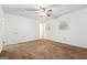 This bedroom features a ceiling fan and natural light at 954 Camp Creek Sw Dr, Lilburn, GA 30047