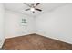 Neutral bedroom featuring a ceiling fan and a window at 954 Camp Creek Sw Dr, Lilburn, GA 30047