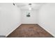 Minimalist bedroom with carpet, a ceiling fan, and a window creating a calm atmosphere at 954 Camp Creek Sw Dr, Lilburn, GA 30047