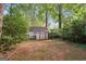 Backyard storage shed with double doors for easy access and ample storage at 954 Camp Creek Sw Dr, Lilburn, GA 30047