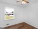Sun-filled bedroom with hardwood floors and a window offering natural light at 840 Jett Rd, Jonesboro, GA 30236