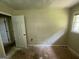 This bedroom features a window, a wall heater and an open doorway at 3144 Clemons Rd, Stockbridge, GA 30281