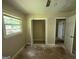 This bedroom features a window, a ceiling fan and an closet with an open door at 3144 Clemons Rd, Stockbridge, GA 30281