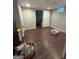 Spacious basement room with vinyl flooring, closet, and natural light from a small window at 375 Big Game Way, Loganville, GA 30052