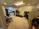 Finished basement area with office space, exercise equipment, and a kitchenette at 375 Big Game Way, Loganville, GA 30052