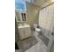 Basement bathroom featuring a white vanity and a shower with patterned curtain at 375 Big Game Way, Loganville, GA 30052