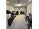 Basement features a treadmill, office area, and a rocking chair for relaxation at 375 Big Game Way, Loganville, GA 30052