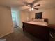 Bedroom featuring a wood sleigh bed, neutral carpet, and natural light at 375 Big Game Way, Loganville, GA 30052