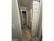 Hallway with tile flooring and multiple closet spaces, leading to bathroom and other areas at 375 Big Game Way, Loganville, GA 30052