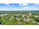 An expansive aerial perspective captures residences amid a vibrant community and lush green trees at 32 Ivy Ne Pkwy, Atlanta, GA 30342