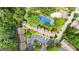 An aerial shot showcasing the community, tennis court, parking, and the surrounding greenery at 32 Ivy Ne Pkwy, Atlanta, GA 30342
