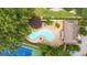 An aerial view of the pool, tennis court, and lush surroundings offering a luxurious lifestyle at 32 Ivy Ne Pkwy, Atlanta, GA 30342