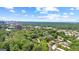 Expansive aerial view displaying the community amongst mature trees, near the city at 32 Ivy Ne Pkwy, Atlanta, GA 30342