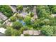 Overhead view of an apartment complex, showcasing lush greenery, pool, and tennis court at 32 Ivy Ne Pkwy, Atlanta, GA 30342