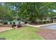 Community featuring a tennis court, picnic tables and barbecue, adjacent to a walking path at 32 Ivy Ne Pkwy, Atlanta, GA 30342