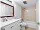 Bathroom features a tub and shower, vanity with white countertop and cabinetry, and a mirror at 32 Ivy Ne Pkwy, Atlanta, GA 30342