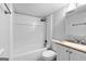 Clean and functional bathroom with a tub/shower combo, white fixtures, and neutral decor at 32 Ivy Ne Pkwy, Atlanta, GA 30342