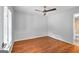Bedroom with hardwood floors, a ceiling fan, and natural light from window at 32 Ivy Ne Pkwy, Atlanta, GA 30342