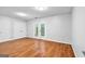 Spacious bedroom with hardwood floors, a closet, and access to the patio at 32 Ivy Ne Pkwy, Atlanta, GA 30342