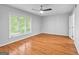 Bedroom with hardwood floors, a ceiling fan, and large window at 32 Ivy Ne Pkwy, Atlanta, GA 30342