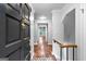 Inviting foyer featuring hardwood floors, staircase, and a view into the bright, open living space at 32 Ivy Ne Pkwy, Atlanta, GA 30342
