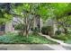 Exterior view of townhome showcasing meticulous landscaping, a stone walkway, and inviting entrance at 32 Ivy Ne Pkwy, Atlanta, GA 30342