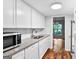 Bright kitchen featuring granite countertops, stainless sink, and a view into the dining room at 32 Ivy Ne Pkwy, Atlanta, GA 30342