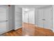 Open-concept space with wood floors, built in shelving and ample natural light at 32 Ivy Ne Pkwy, Atlanta, GA 30342