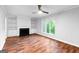 Spacious living room with hardwood floors, built-in shelves, fireplace, and large window views at 32 Ivy Ne Pkwy, Atlanta, GA 30342