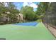 Tennis court surrounded by mature trees offering an active outdoor lifestyle and recreation at 32 Ivy Ne Pkwy, Atlanta, GA 30342