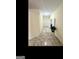 Open foyer featuring tile flooring, neutral walls, and a view of the front door and a potted plant at 180 Tabor Forest Dr, Oxford, GA 30054