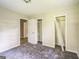 Bedroom boasts neutral walls, carpet flooring and multiple closets, offering plenty of storage at 6770 Burkhead Dr, Union City, GA 30291