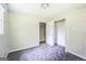 Bedroom featuring neutral walls, carpet flooring and a closet, providing lots of room at 6770 Burkhead Dr, Union City, GA 30291