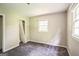 Bedroom with lots of natural light and neutral walls and carpeted floor with closet space at 6770 Burkhead Dr, Union City, GA 30291