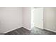 Bedroom featuring neutral walls, carpet flooring, and an open door, providing lots of room at 6770 Burkhead Dr, Union City, GA 30291