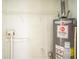 Functional utility room with shelving and a hot water heater installed at 6770 Burkhead Dr, Union City, GA 30291