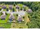 Aerial view of the neighborhood shows lush trees, well-maintained landscaping, spacious yards, and a cul-de-sac at 4770 Macy Way, Ellenwood, GA 30294
