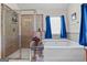 Bright bathroom with a separate tub and stand-up shower with tile surround at 4770 Macy Way, Ellenwood, GA 30294