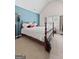 Upstairs bedroom with vaulted ceilings, neutral walls and a vintage wooden bed frame at 4770 Macy Way, Ellenwood, GA 30294