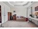 Spacious bedroom with tray ceilings, carpet, and neutral walls at 4770 Macy Way, Ellenwood, GA 30294